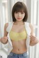 A woman in a yellow bra and jeans posing for a picture.